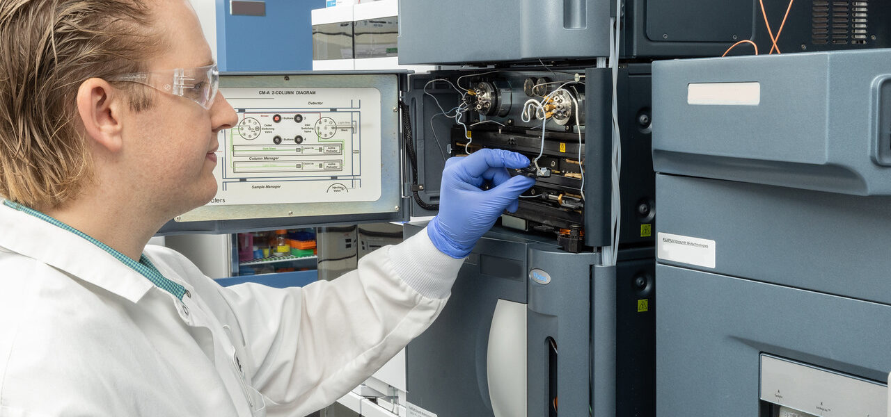 researcher working with lab items