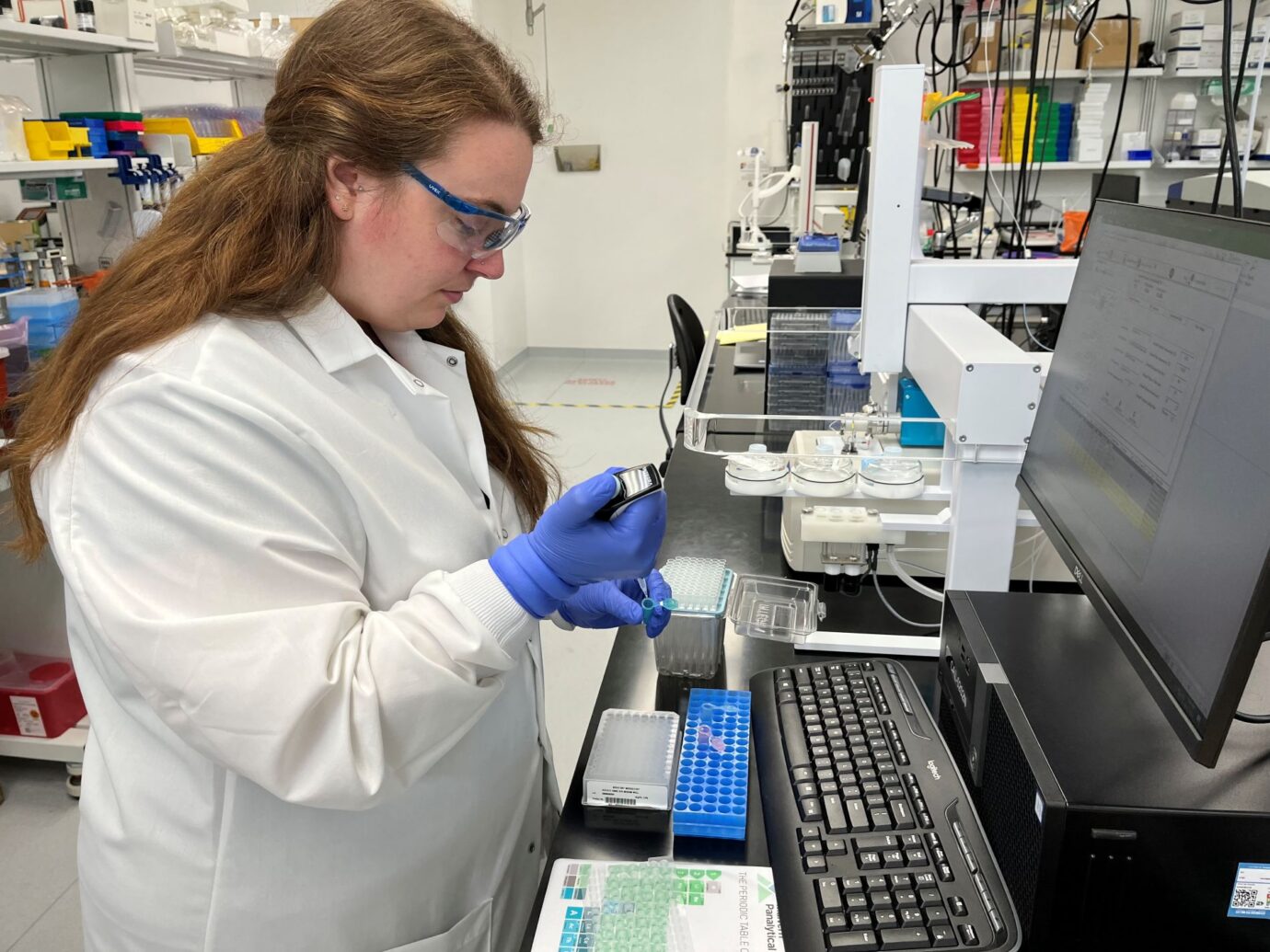 Scientist filling a syringe
