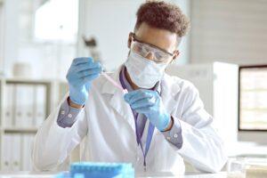 Researcher with a pipette