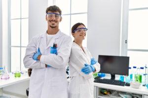 Two researchers wearing protective lab gear