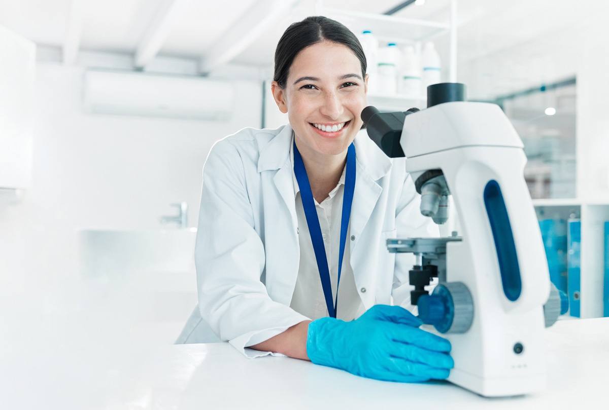 Researcher with a microscope