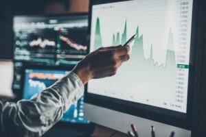 hand pointing at a chart